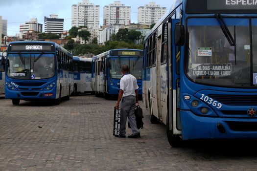 salvador, bahia, brazil - april 4, 2019: Bus driver are seen in during gravel movement in a company garage in the city of Salvador.