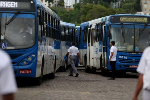 salvador, bahia, brazil - april 4, 2019: Bus driver are seen in during gravel movement in a company garage in the city of Salvador.