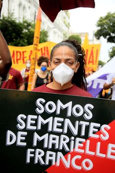 salvador, bahia, brazil - july 24, 2018: Black woman wearing mask during protest against President Jair Bolsonaro's government in the city of Salvador.