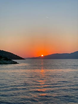 Tourist admiring the sunrise on tropical island - stock photo. High quality photo