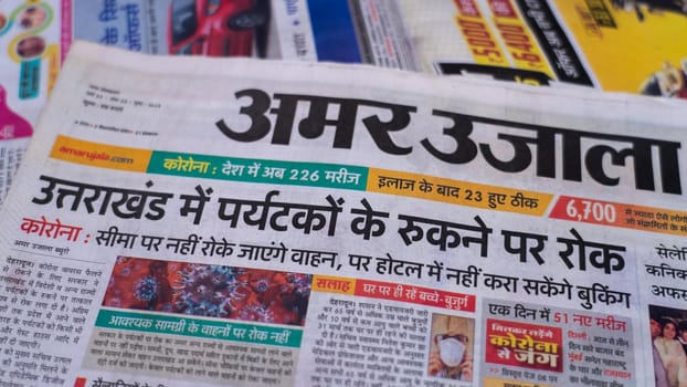 Dehradun, Uttarakhand India June 28, 2021. Hindi, Coronavirus COVID-19 News Headline in Newspaper of India. Headlines of the month March, April 2020.