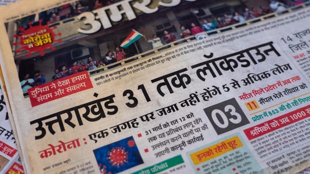 Dehradun, Uttarakhand India June 28, 2021. Hindi, Coronavirus COVID-19 News Headline in Newspaper of India. Headlines of the month March, April 2020.