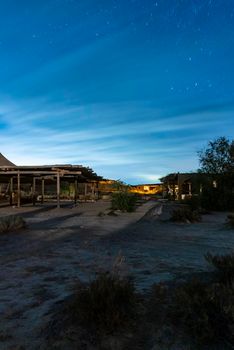 Long exposure of stars causing light trails. The Milky Way galaxy. Night accommodation in the desert. Nizana, Israel. High quality photo