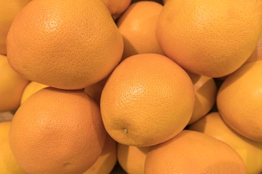 ripe delicious oranges close up as a background. High quality photo