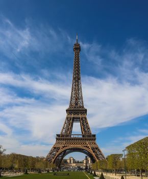 Eiffel Tower in Paris France against blue sky with clouds. April 2019