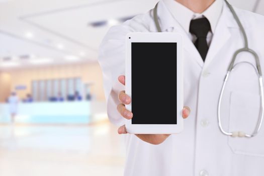 close-up doctor showing tablet computer blank screen in hospital