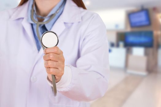 close up stethoscope with female doctor in hospital background