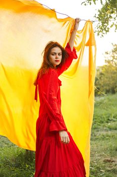 pretty woman nature yellow cloth fresh air glamor. High quality photo