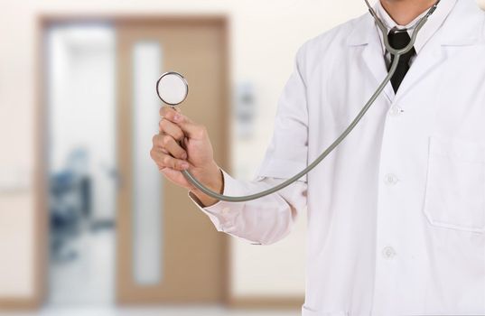 doctor with stethoscope in hospital background