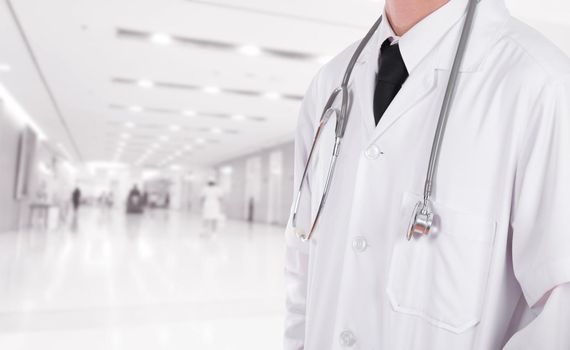 doctor with stethoscope in hospital background