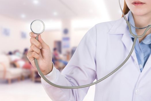 close up stethoscope with female doctor in hospital background