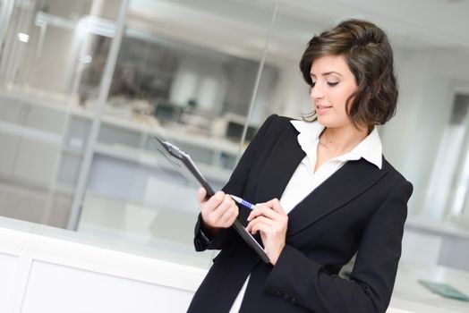 Portrait of business woman in modern glass interior