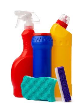 Bottles with cleaning products and sponge on a white isolated background, copy space