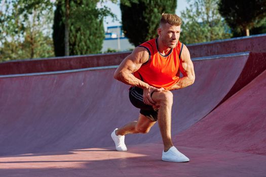 man doing exercises outdoors in the park. High quality photo