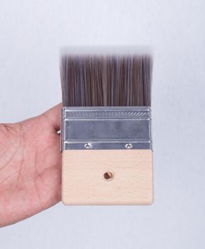 brush for color paint concrete Loft style in hand