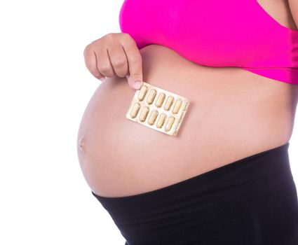 pregnant woman with pack of pills in her hands isolated on white background