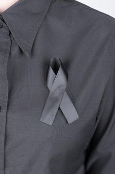 black shirt with black ribbons as a sign of mourning