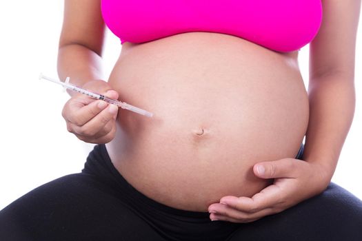 Pregnant woman with syringe isolated on white background