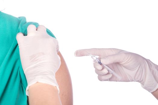 nurse with syringe giving a vaccine for a patient on white background