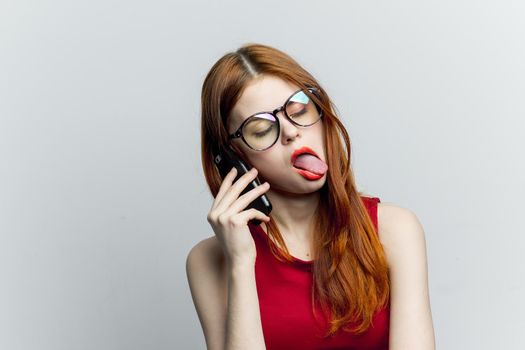 pretty woman with glasses talking on the phone technology lifestyle. High quality photo