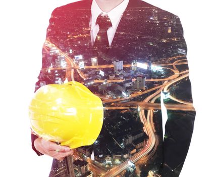 Double exposure of engineer with helmet against a city and traffic isolated on white background