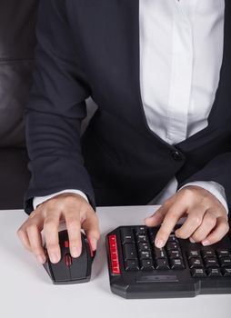 business hands working on computer keyboard and mouse