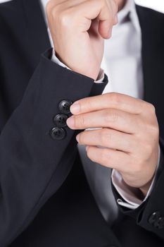 business hand in black suit is dressing up