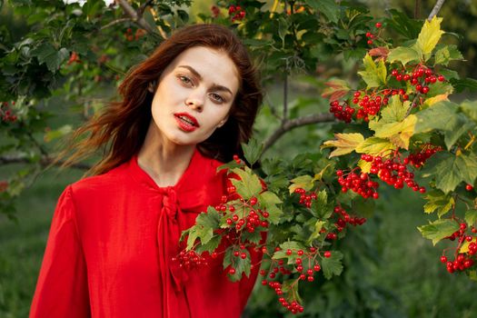 cheerful woman eating berries outdoors fresh air. High quality photo