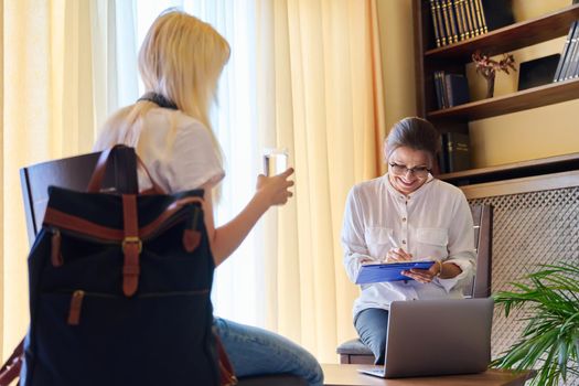 Session of female psychologist and girl teenage student in doctor's office. Consultation, professional assistance of therapist counselor for children and adolescents. Psychology, therapy psychotherapy