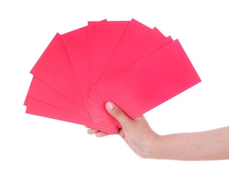 hand holding red envelope in concept of happy chinese new year isolated on a white background