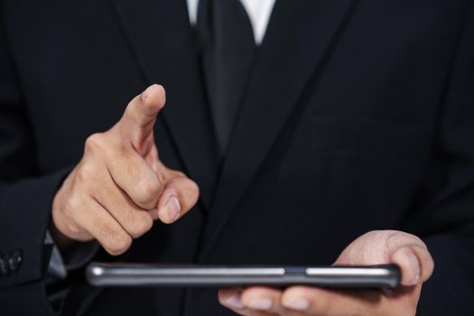 business man holding smartphone and hand touching to virtual touch screen