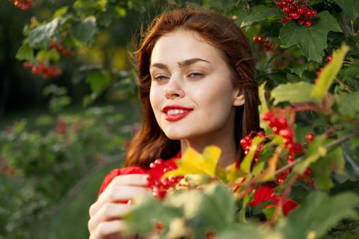 Beautiful woman fresh air summer berries nature. High quality photo