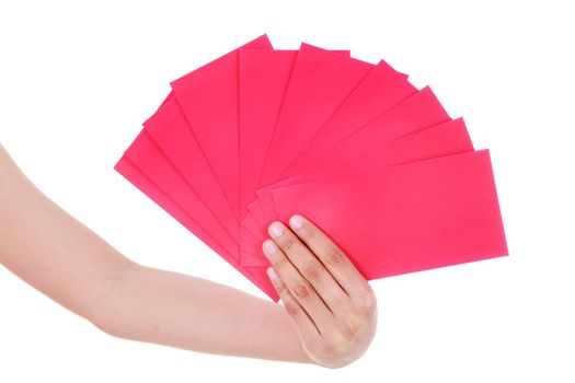 hand holding red envelope in concept of happy chinese new year isolated on a white background
