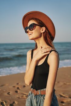 woman walking on the beach landscape sun fun lifestyle. High quality photo