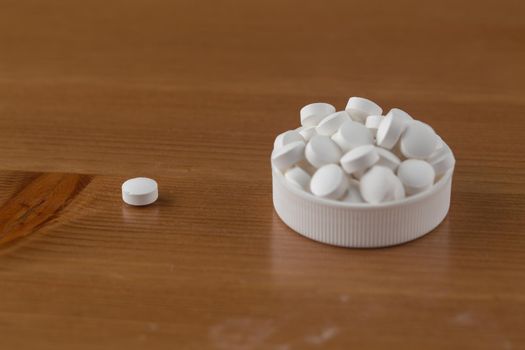 Close up of white pills.