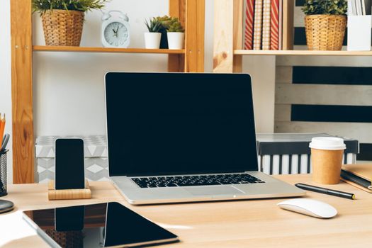 Stylish office table desk. Workspace with laptop. Close up.