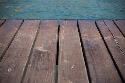 Empty wooden jetty on the lake shore