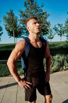 sporty man exercise fitness workout outdoors with dumbbells. High quality photo