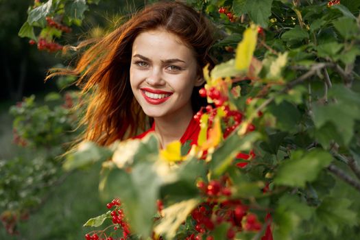 women near bushes nature berries summer lifestyle. High quality photo