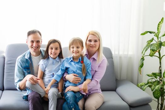 Portrait of a happy family smiling at home