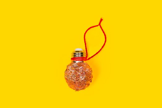 Reuse concept. New year or Christmas DIY decoration made from LED lamps and glitter