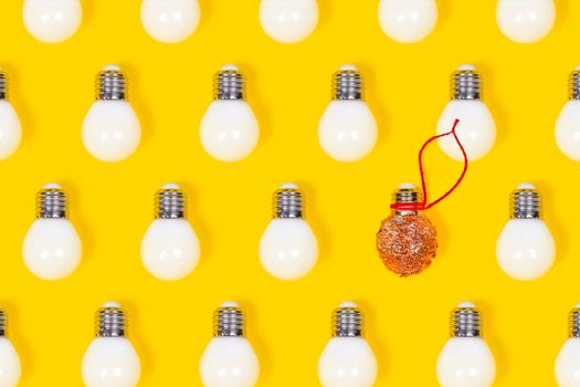 Reuse concept. New year or Christmas DIY decoration made from LED lamps and glitter. Pop art design, creative unique concept.