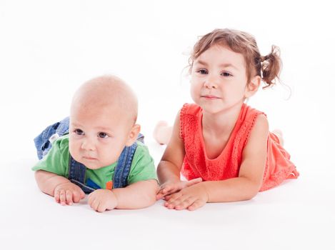 Adorable family. Sister and brother isolated on white