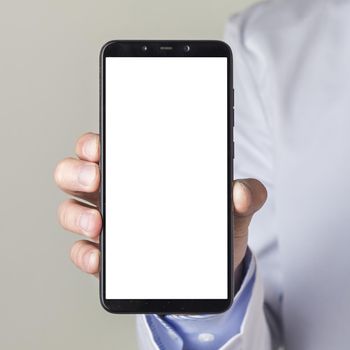 close up male doctor s hand showing smartphone with white screen display