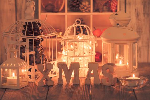 Christmas light and wooden letter decorations in shabby chic style