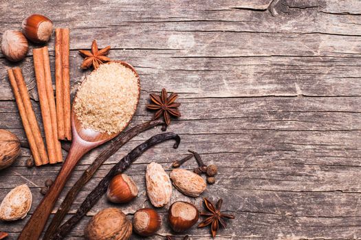 Christmas spices on wooden background with copy space for design