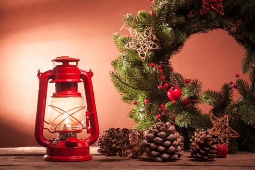Cerosene lamp and Christmas wreath, decorations for holiday