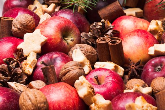 Apples, cones, nuts and cookies with spices. Aroma Christmas