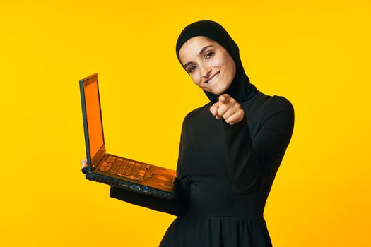 pretty woman laptop in hands learning student emotions ethnicity model. High quality photo