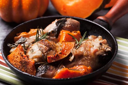 Chicken with pumpkin baked in frying pan